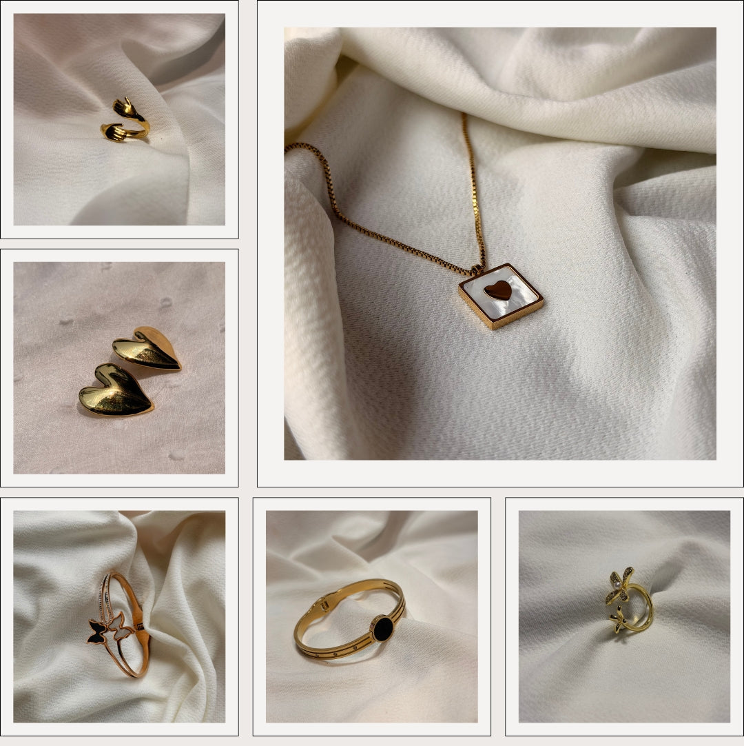 Collage of gold jewelry including earrings, a necklace, and rings on white fabric with 'Ethanajewels' branding.